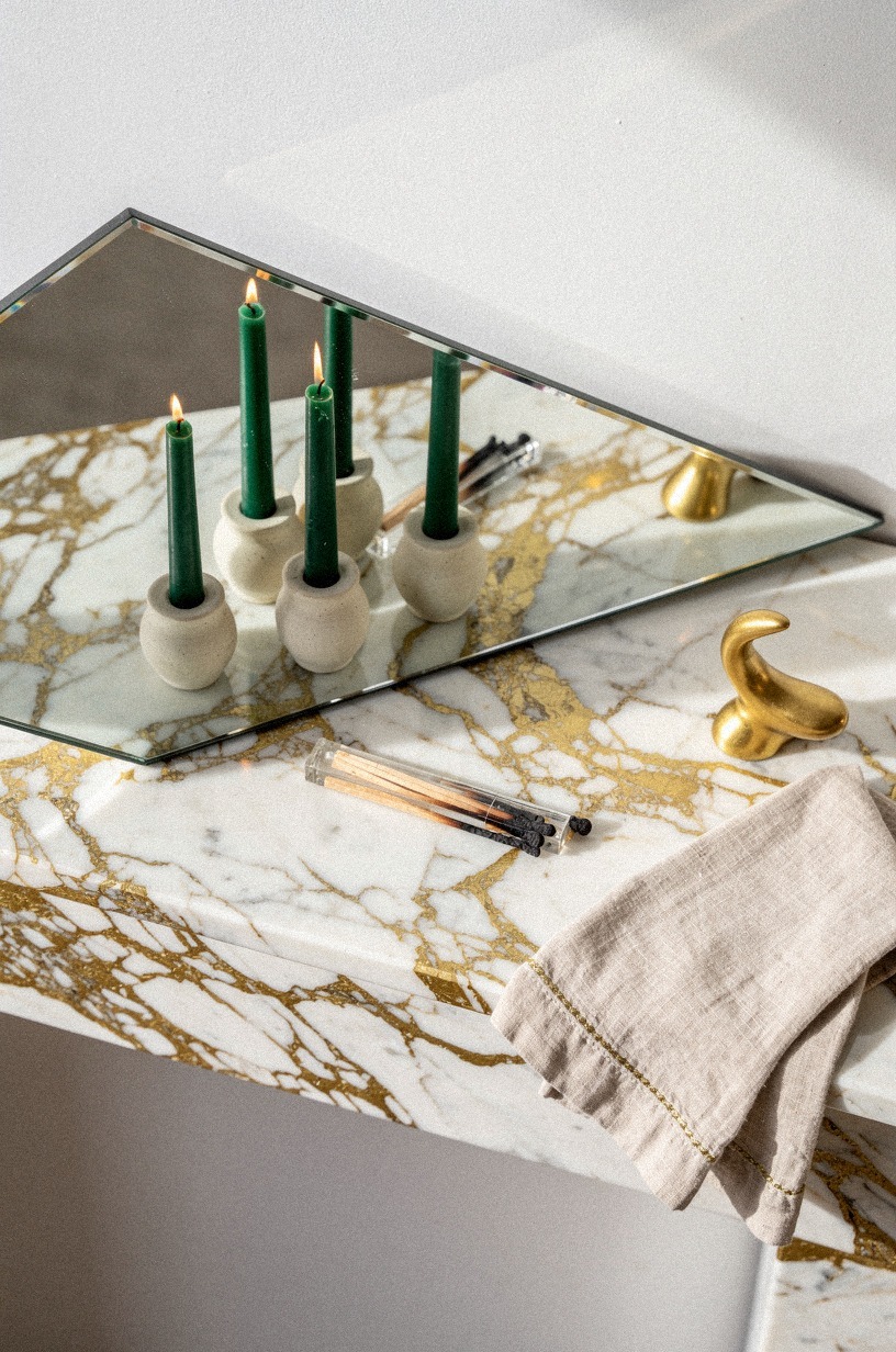Reflect candlelight with a low tilted mirror (Light First, Objects Second)