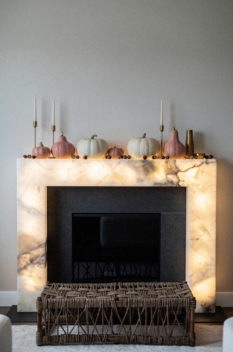 Scatter acorns around low ceramic pumpkins for a quiet base