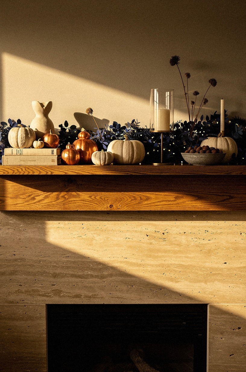 Glow the mantel with amber fairy lights hidden in the greenery
