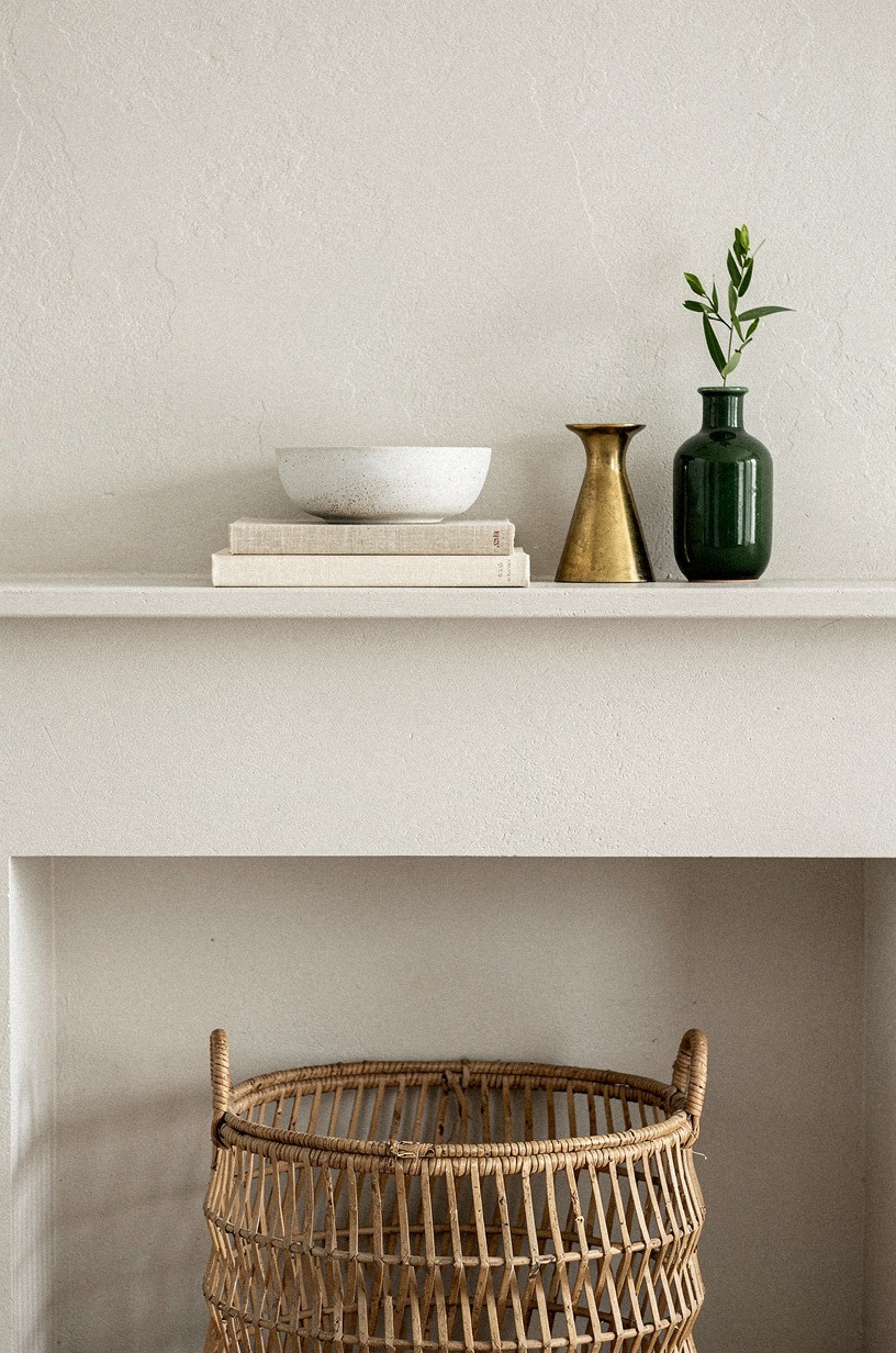 Stack neutral books under a low ceramic bowl