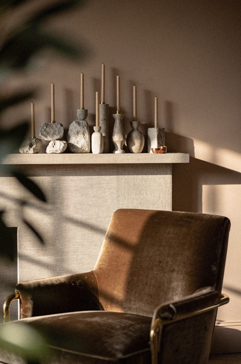 Group taper candles in mixed stone holders