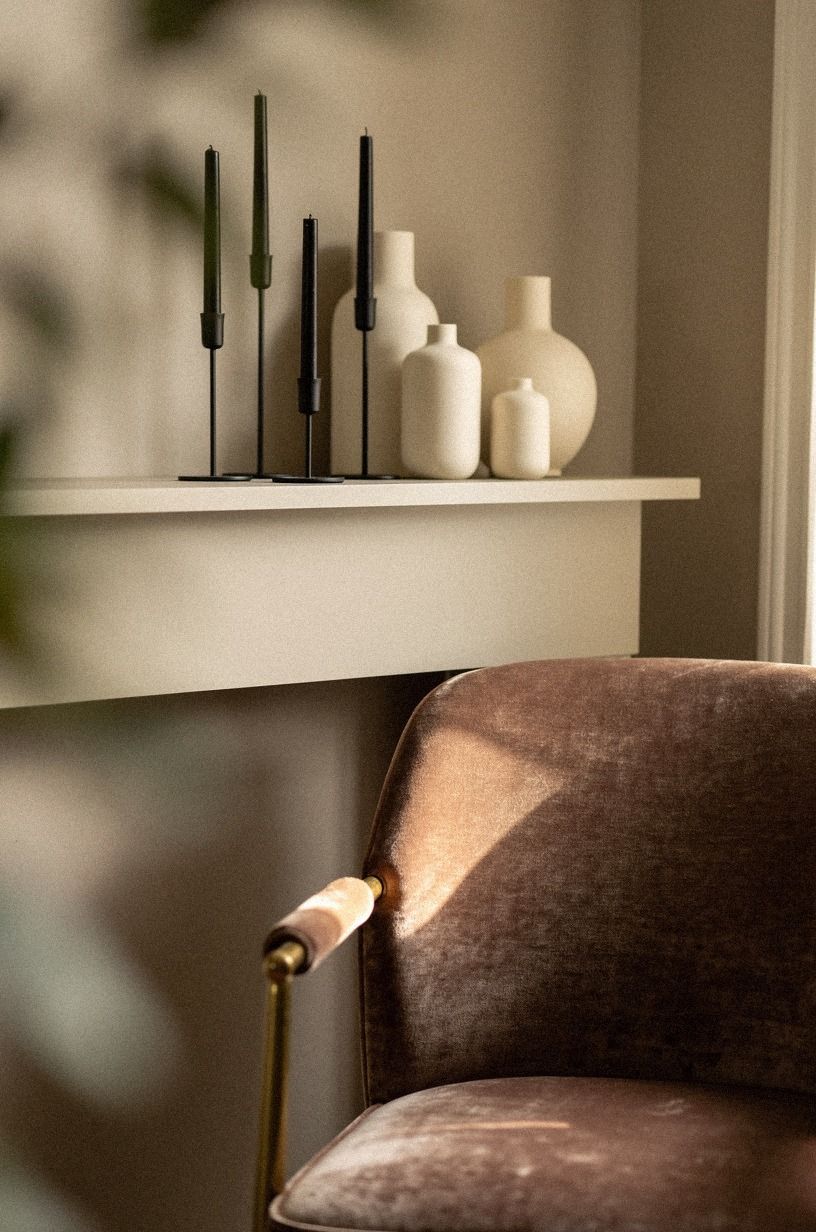 Mix black candlesticks with cream pottery