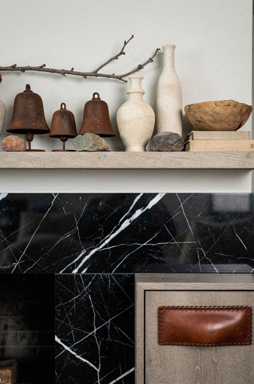 Mix rusted bells with creamy stoneware vases