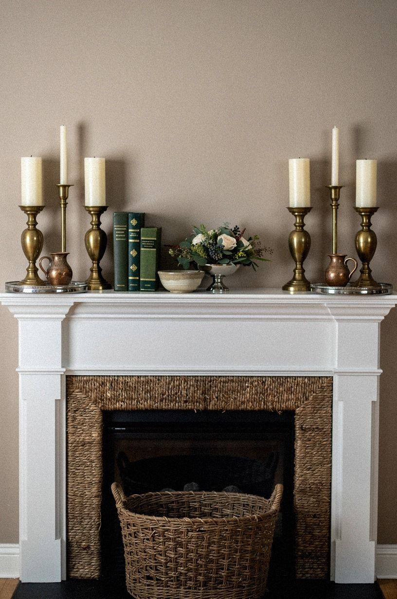 Raised pillar candles on silver footed trays