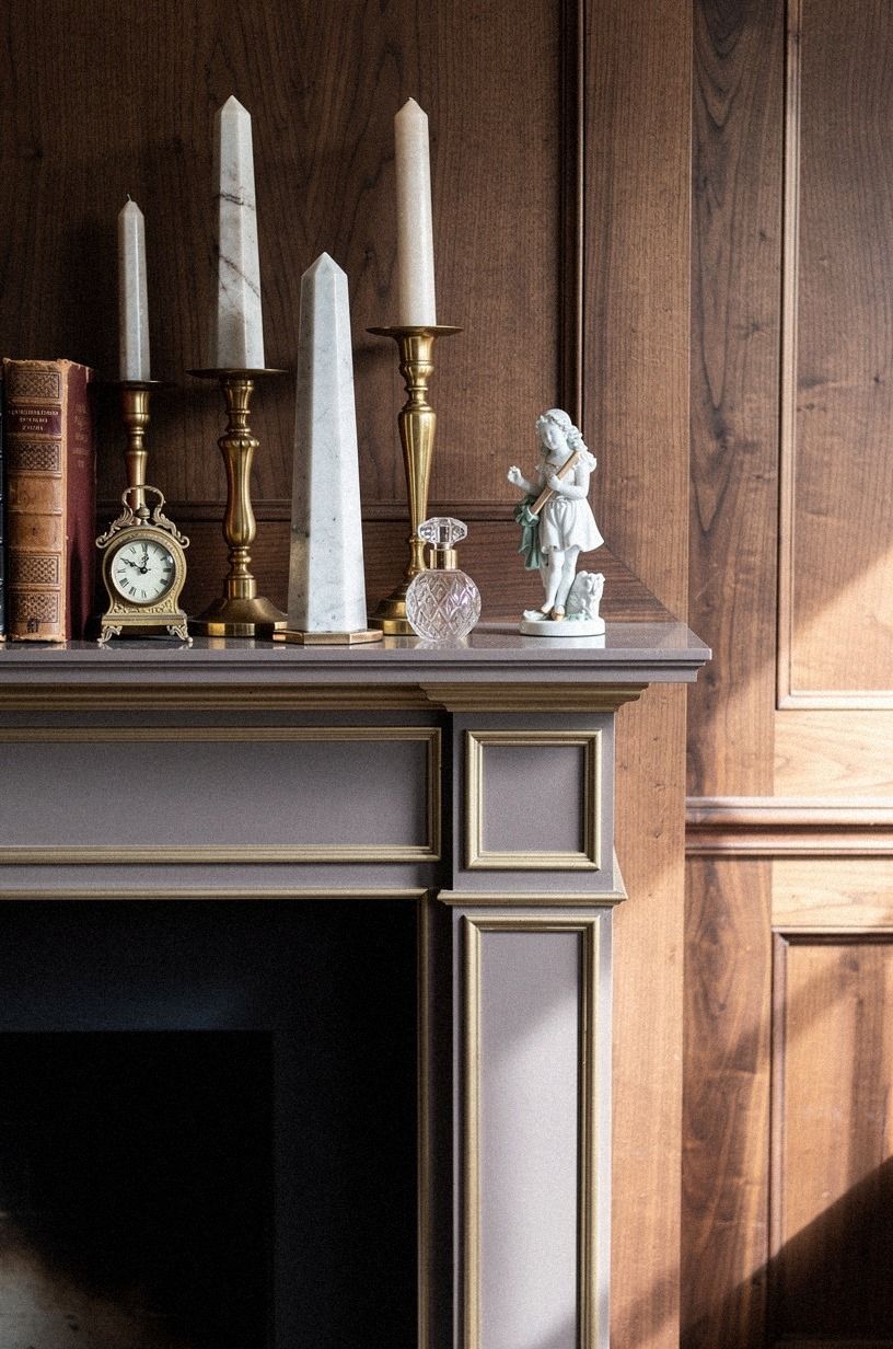 Bookend brass candlesticks with marble obelisks