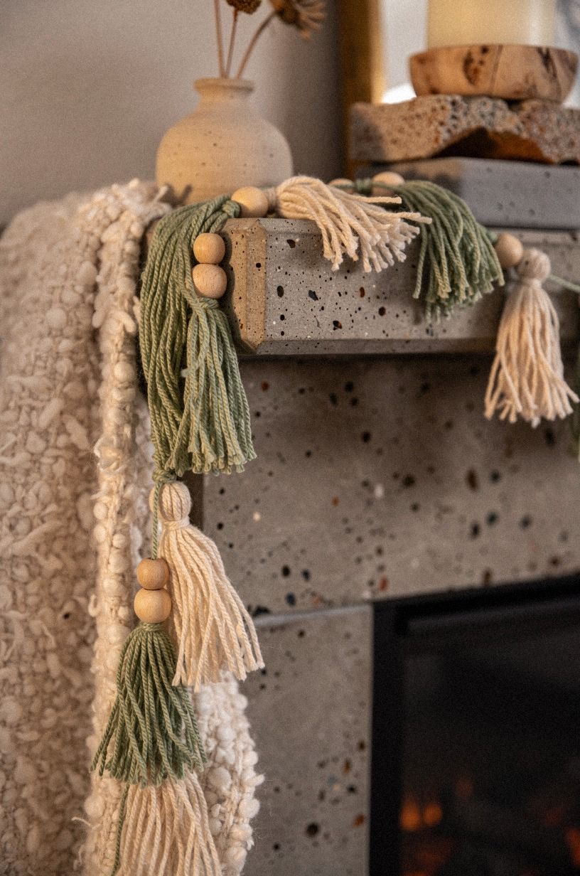 Drape tasseled garland across the mantel lip