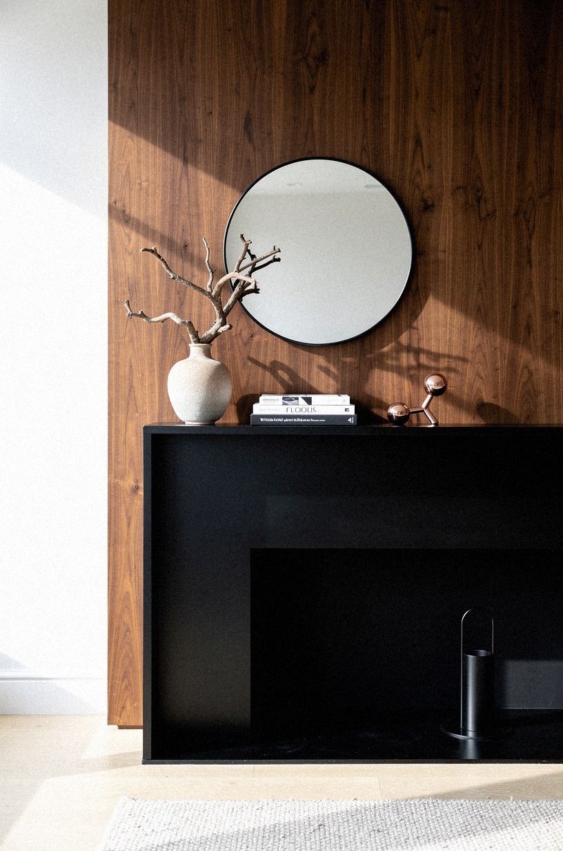 Centered the mirror low over the shelf