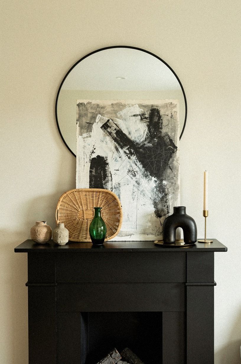 Leant charcoal artwork against the mirror