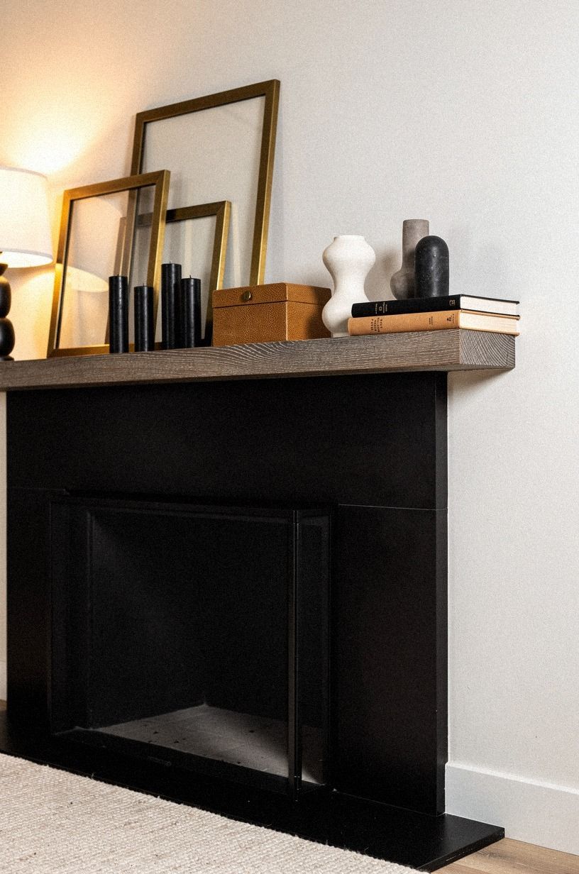 Tucked brass frames behind the candles