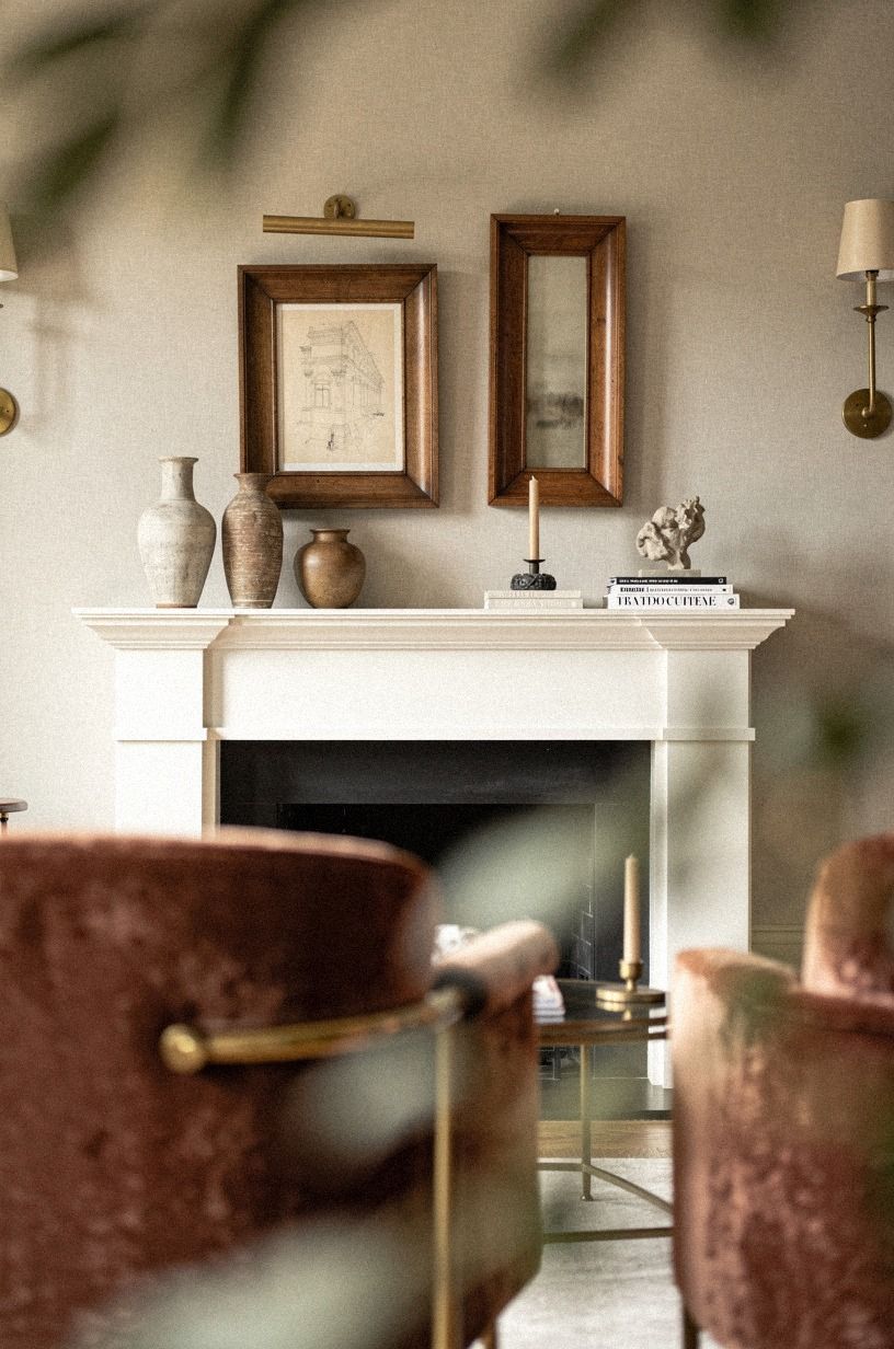 Repeat warm wood frames above the mantel