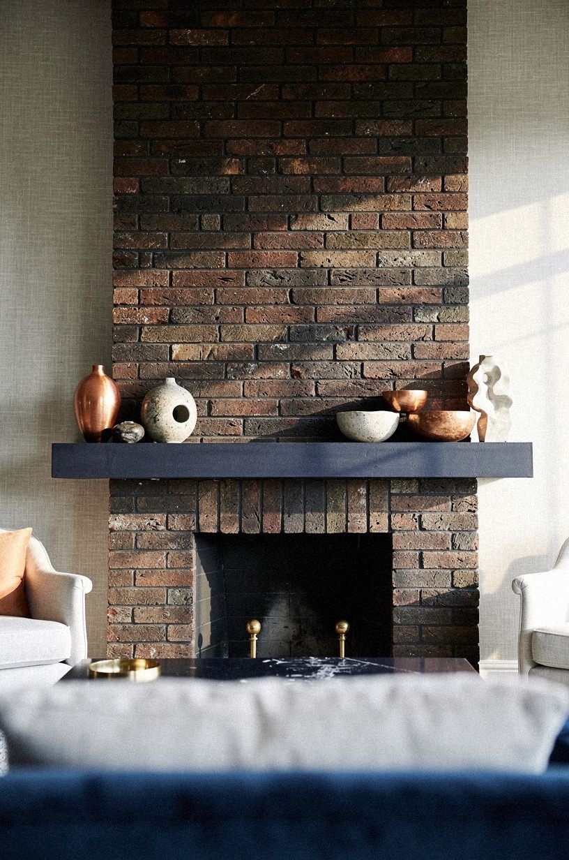 Cluster stone bowls on one mantel corner