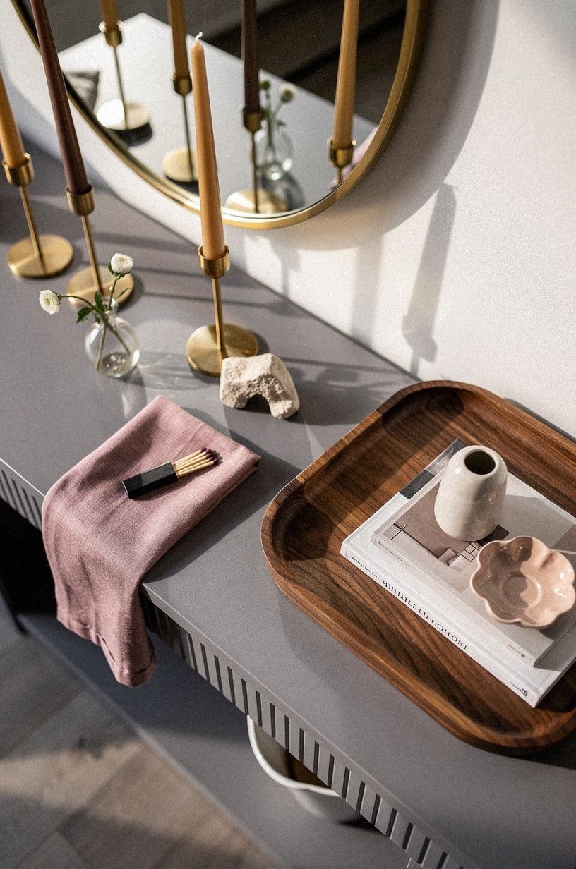 Layer slim brass mirrors behind candles: The Three-Height Light Stack