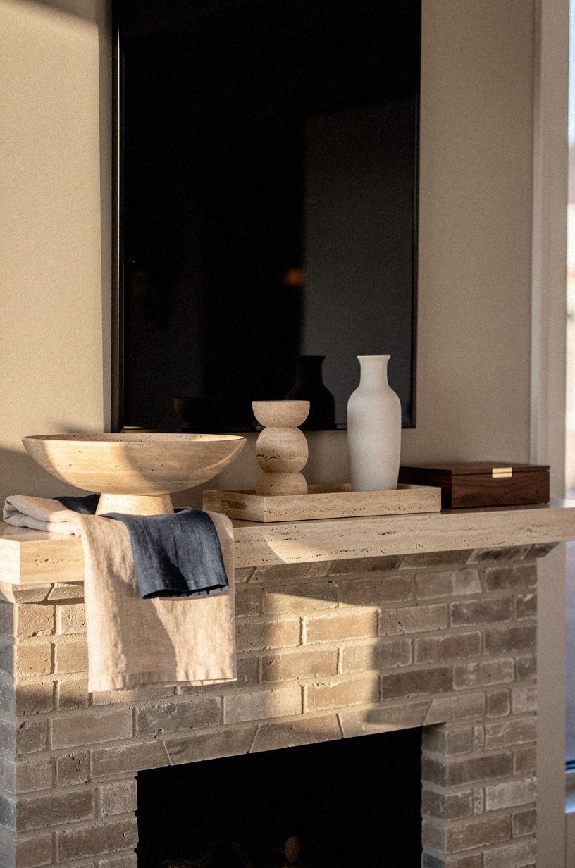 Hang a black mirror above brick: Why this contrast works