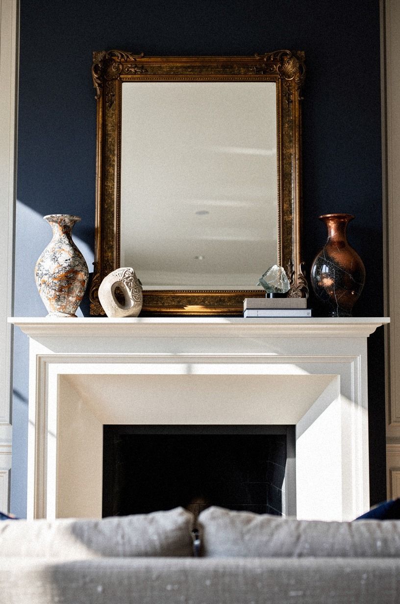 Pair a gilt mirror with marble vases: How to calm a loud frame