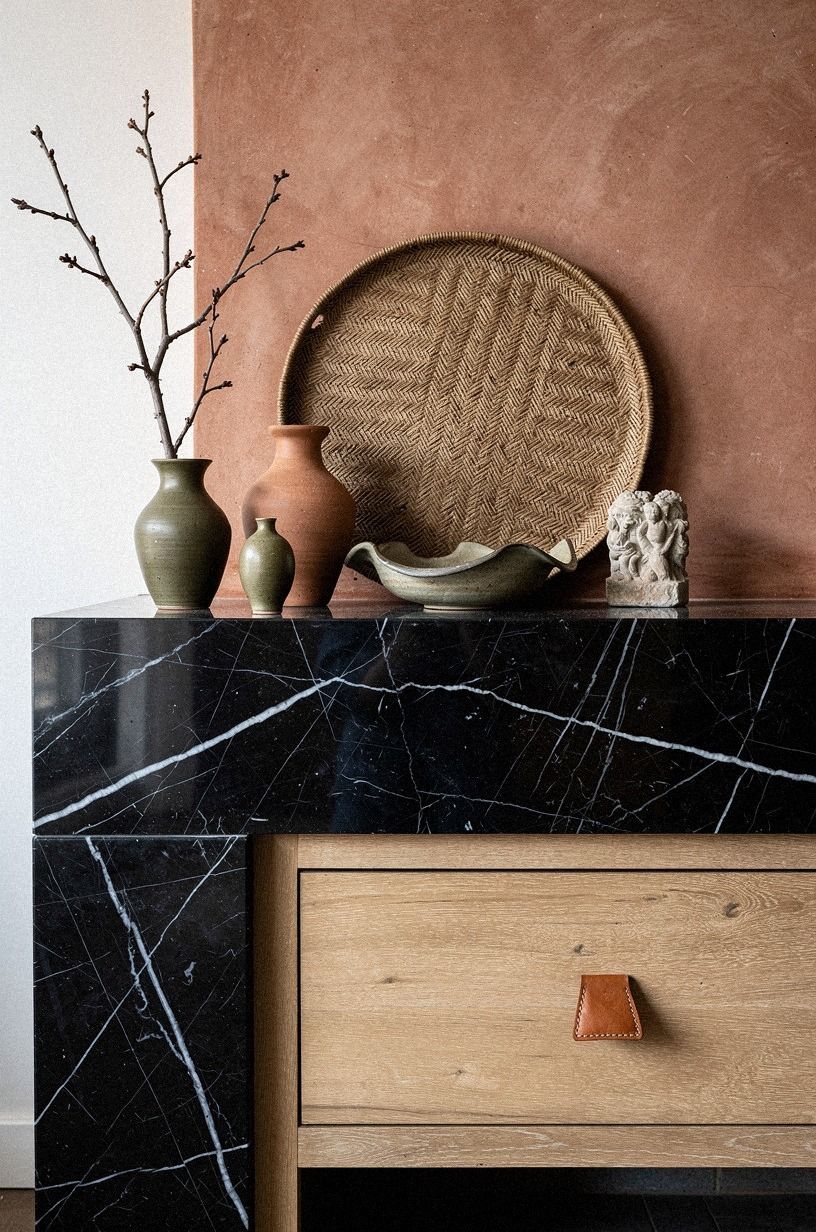 Lean a woven wall tray behind pottery