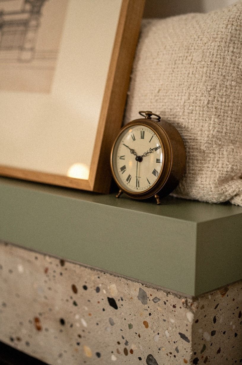 Tuck a petite clock under leaning art