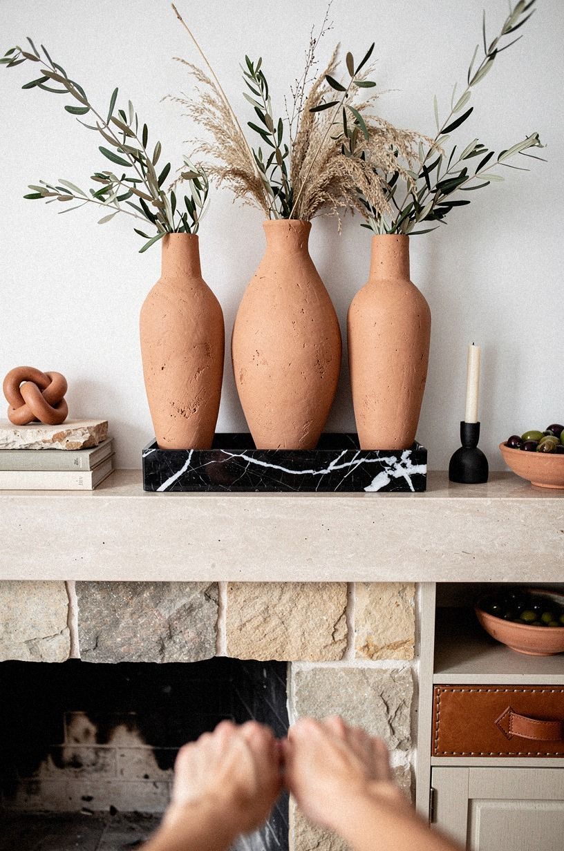 Style a handmade plaster vase cluster