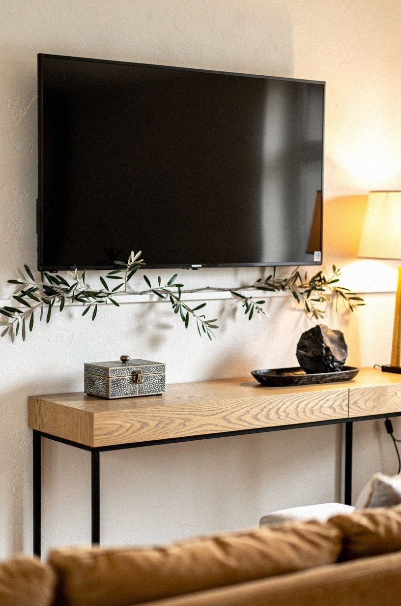 Drape olive branches under the mantel lip