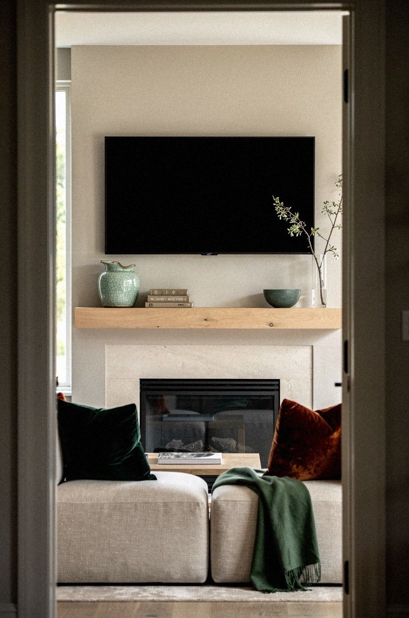 Frame the firebox with low linen ottomans