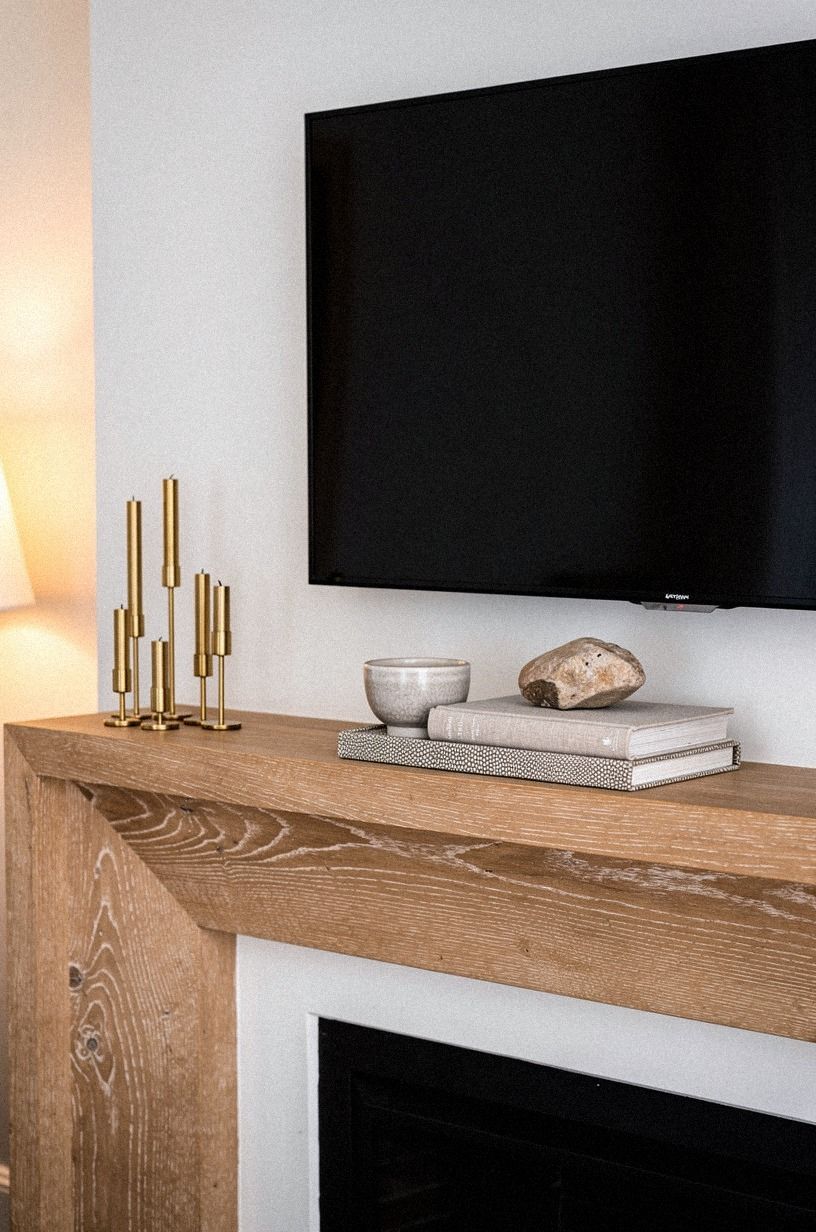 Add taper candles in uneven brass heights
