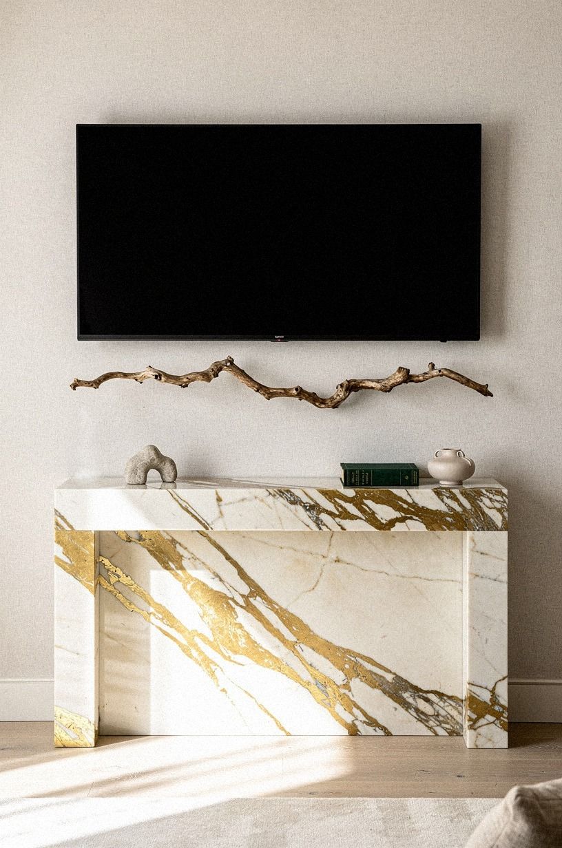 Float one sculptural branch beside the screen