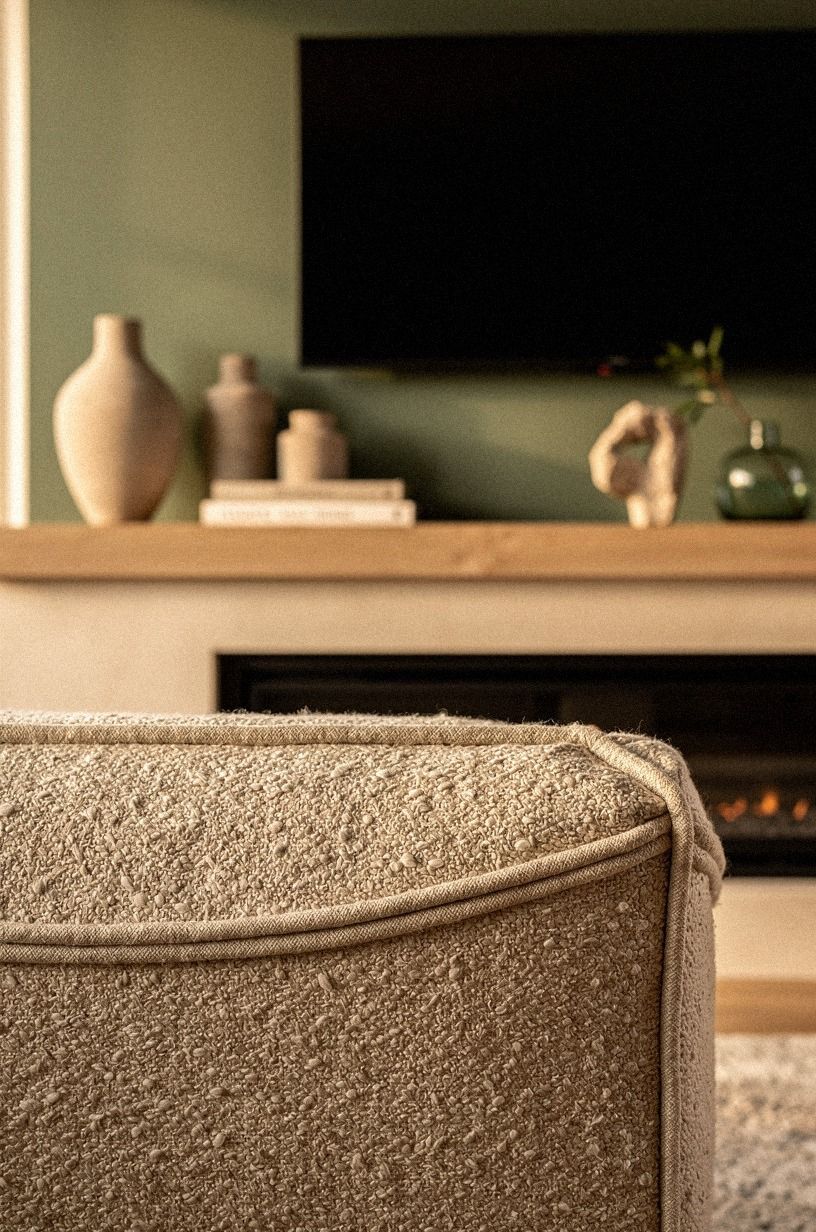 Set linen ottomans near the firebox