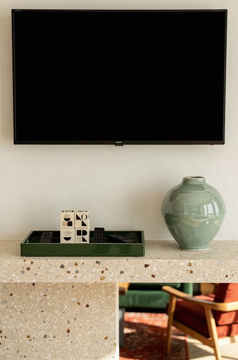 Corral matchboxes and remotes in a lacquer tray