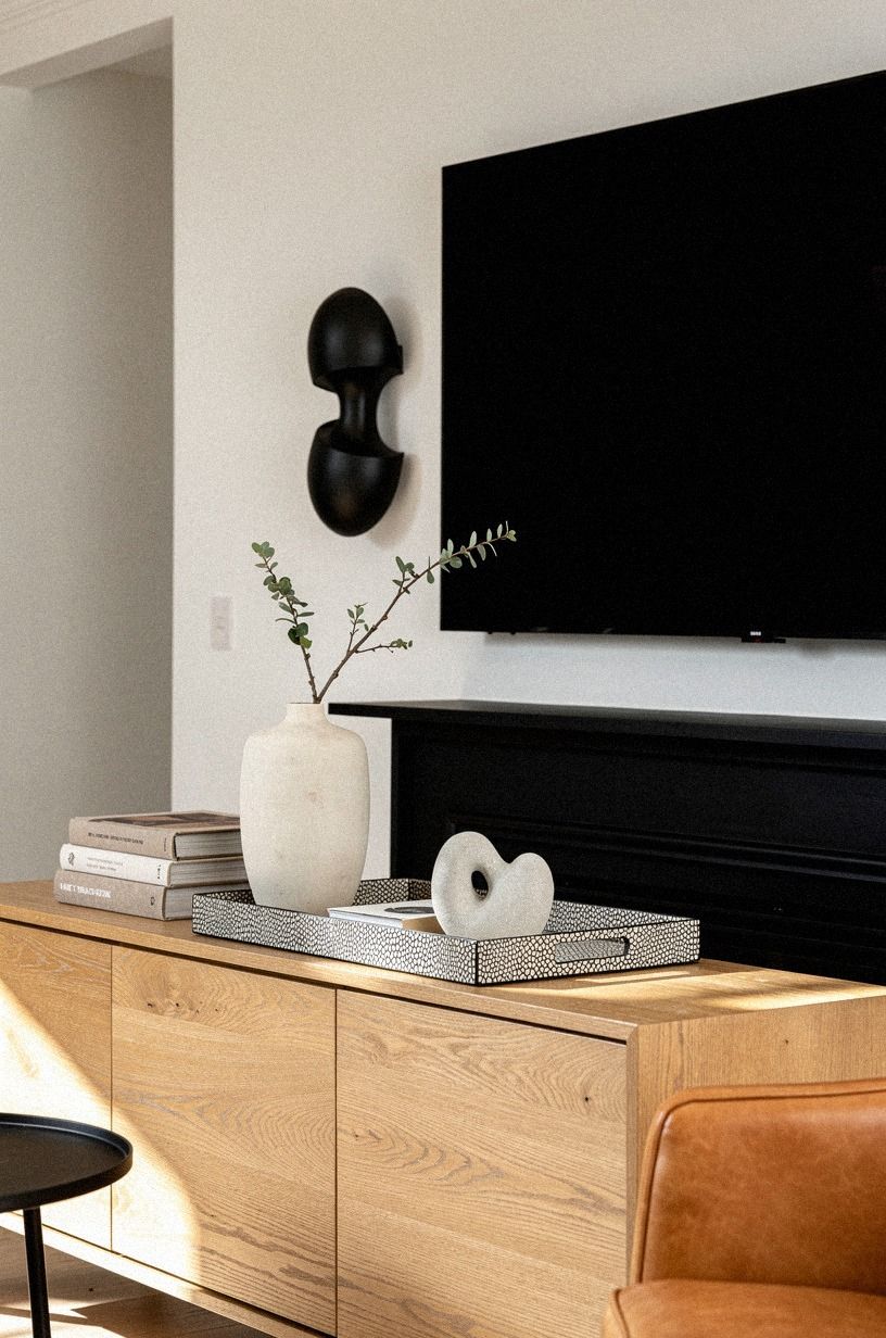 Bookend the mantel with sculptural black sconces