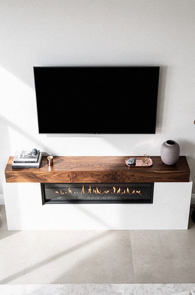 Anchor the wall with a low linear firebox