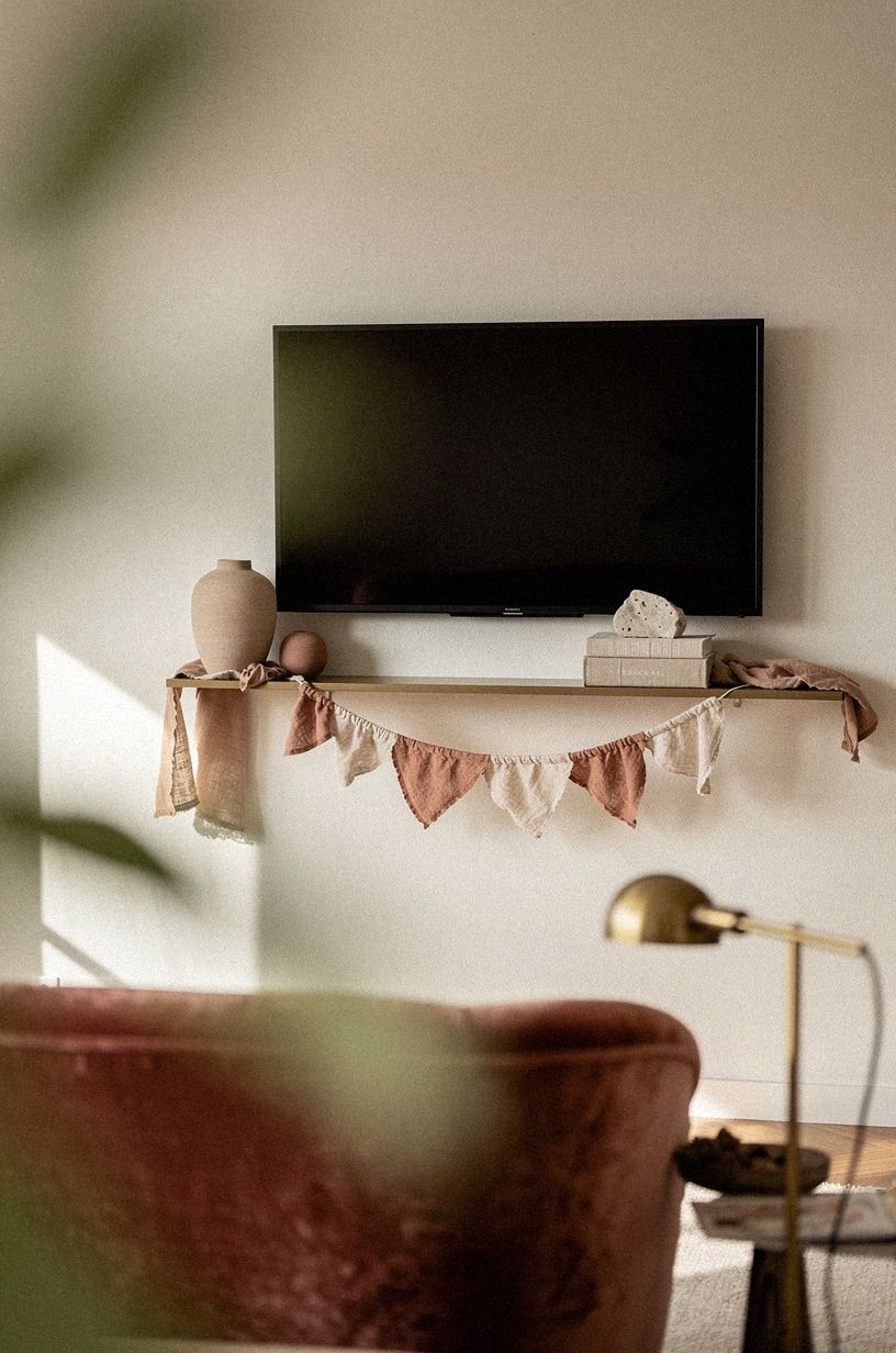 Drape linen garland across the shelf lip