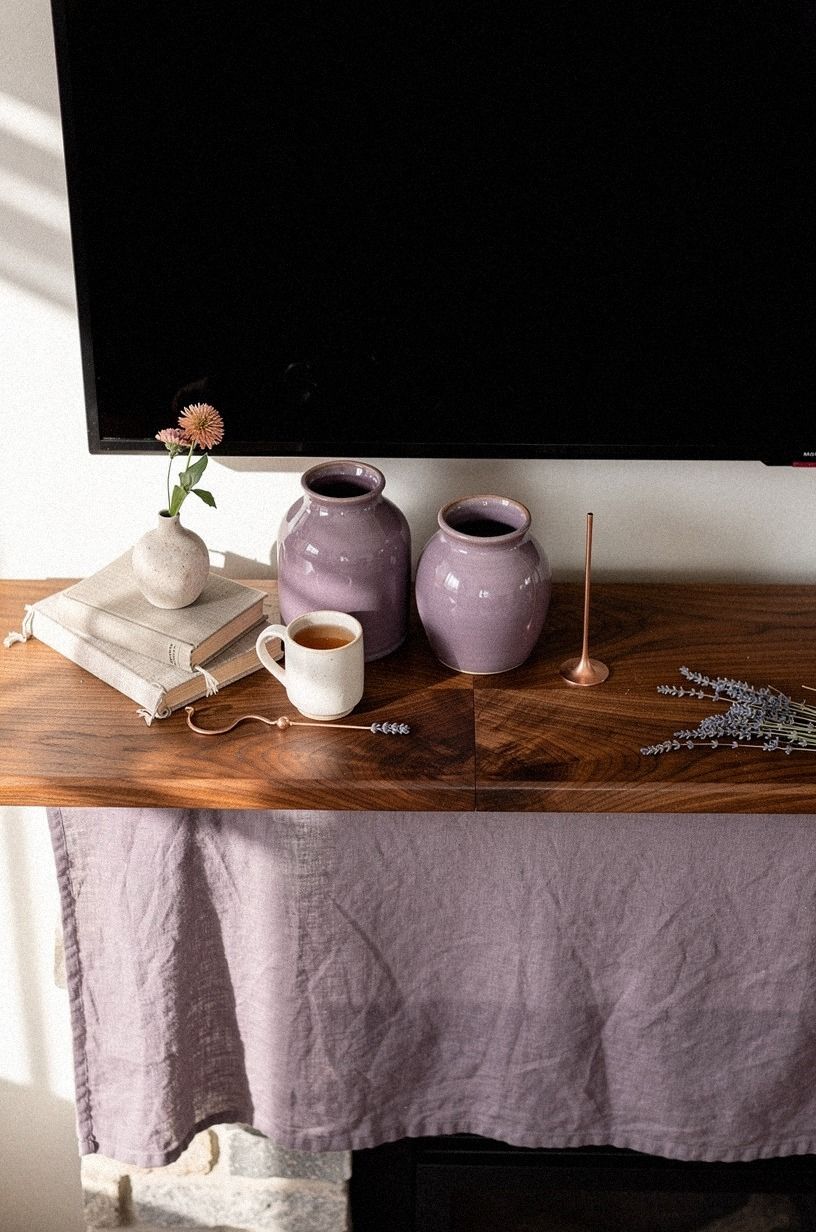 Tuck lavender crocks under the mantel ledge