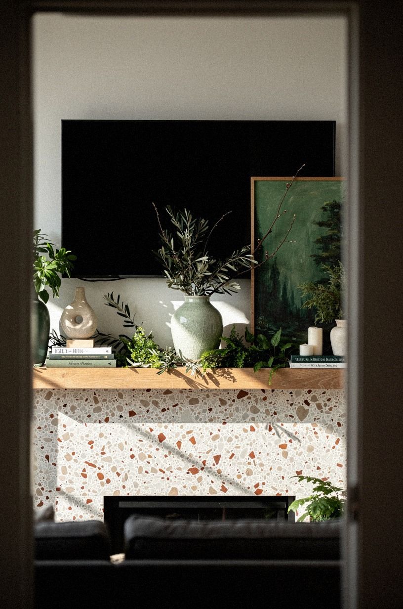 Tuck olive stems along the mantel edge