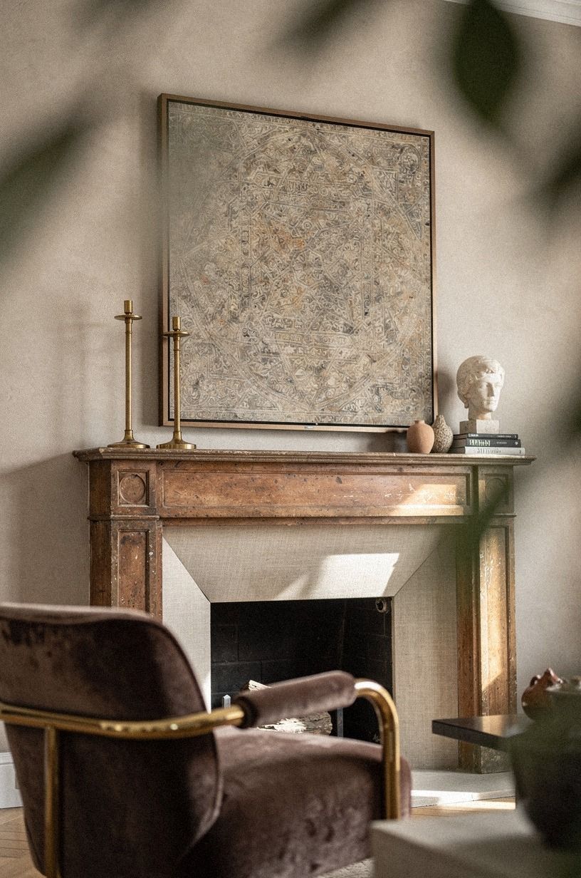 Layer brass candlesticks under the TV corner