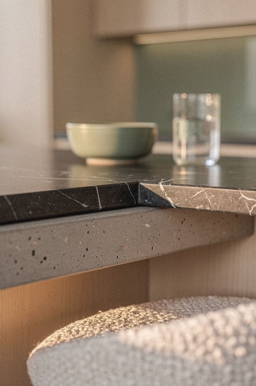 Mix soapstone counters with bleached maple cabinets