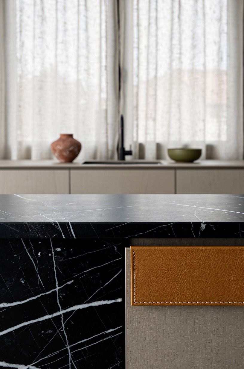 Place linen cafe curtains over the sink