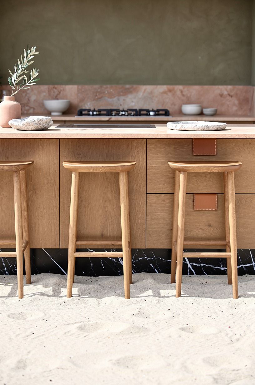 Styled teak stools along the island
