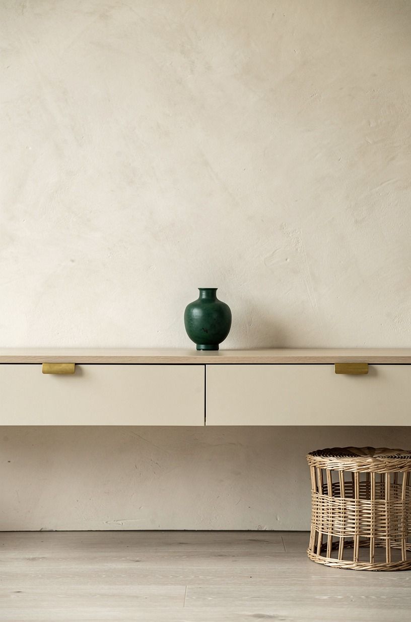 Install edge pulls on floating media cabinets