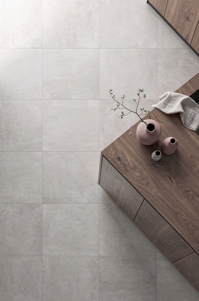 Lay oversized greige porcelain in a calm grid