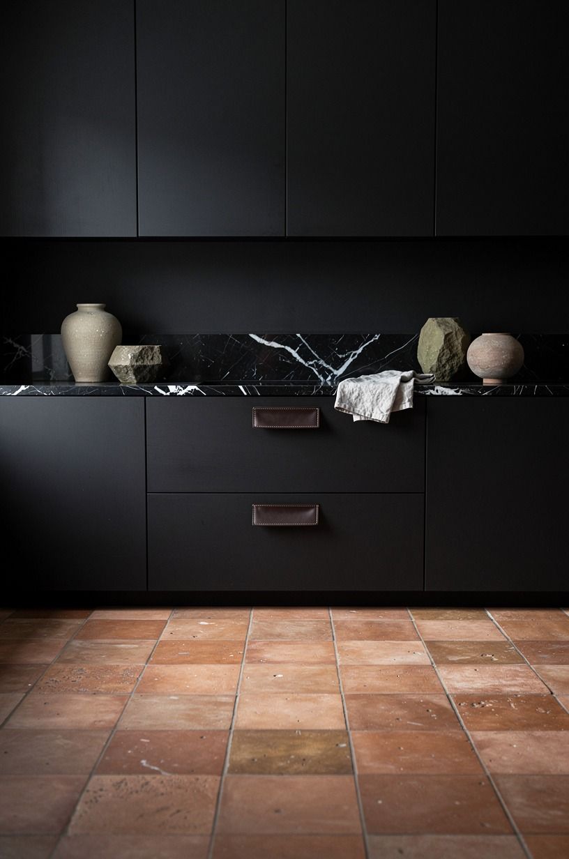 Soften dark cabinets with clay tile flooring