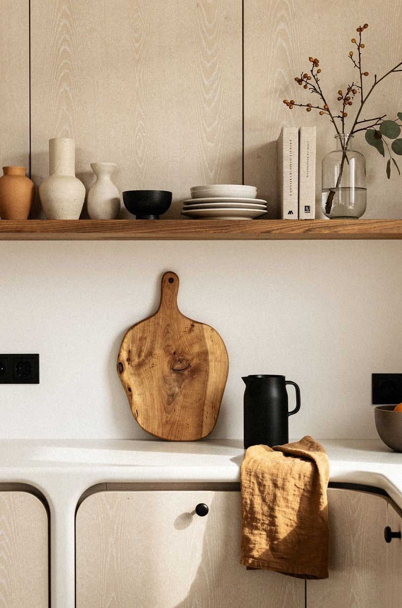 run a single shelf of warm wood across the whole back wall