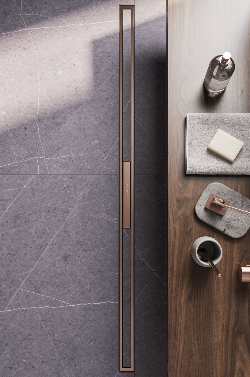 Slope the floor into a hidden linear drain