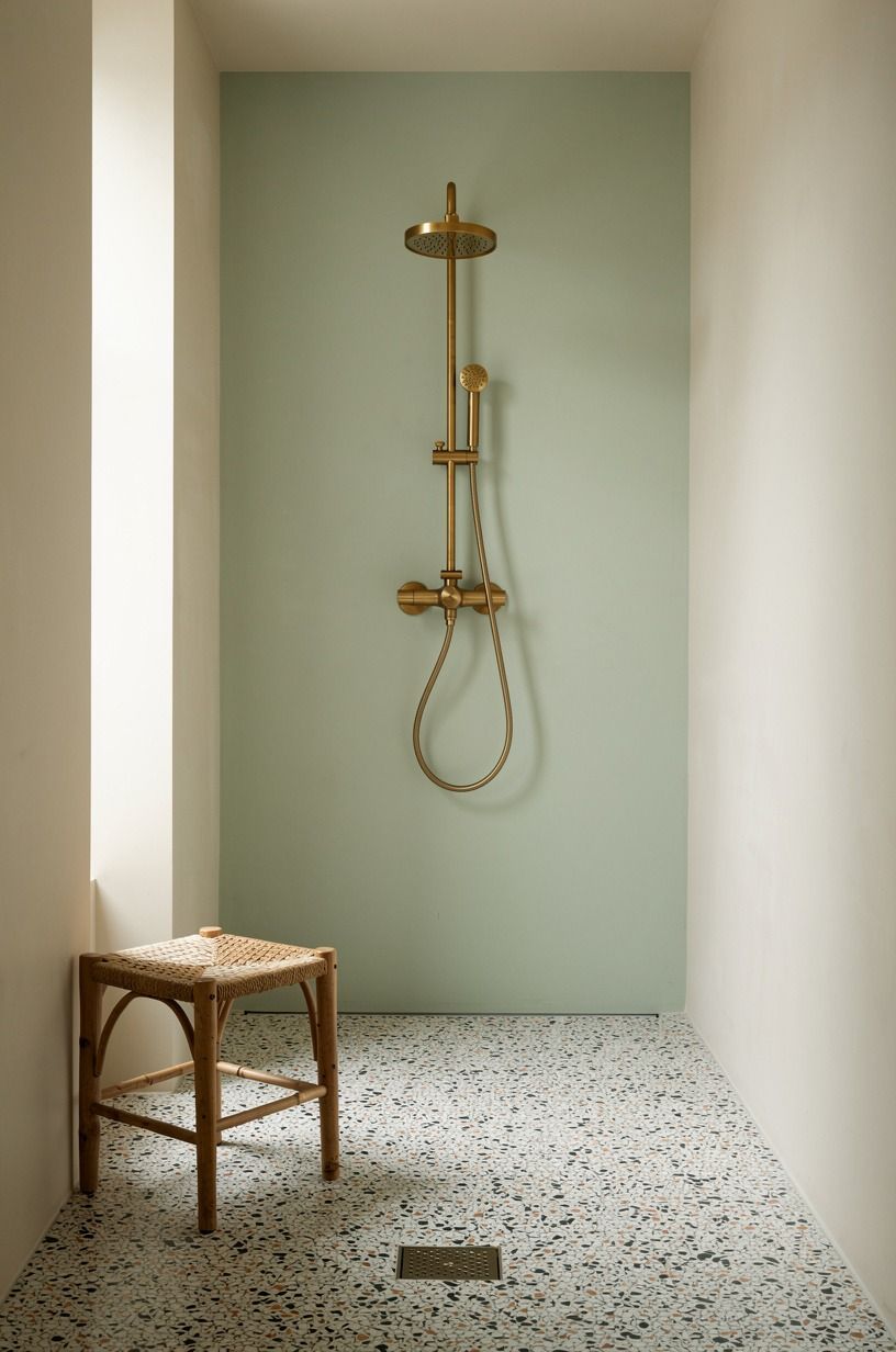 Run terrazzo across the entire shower floor