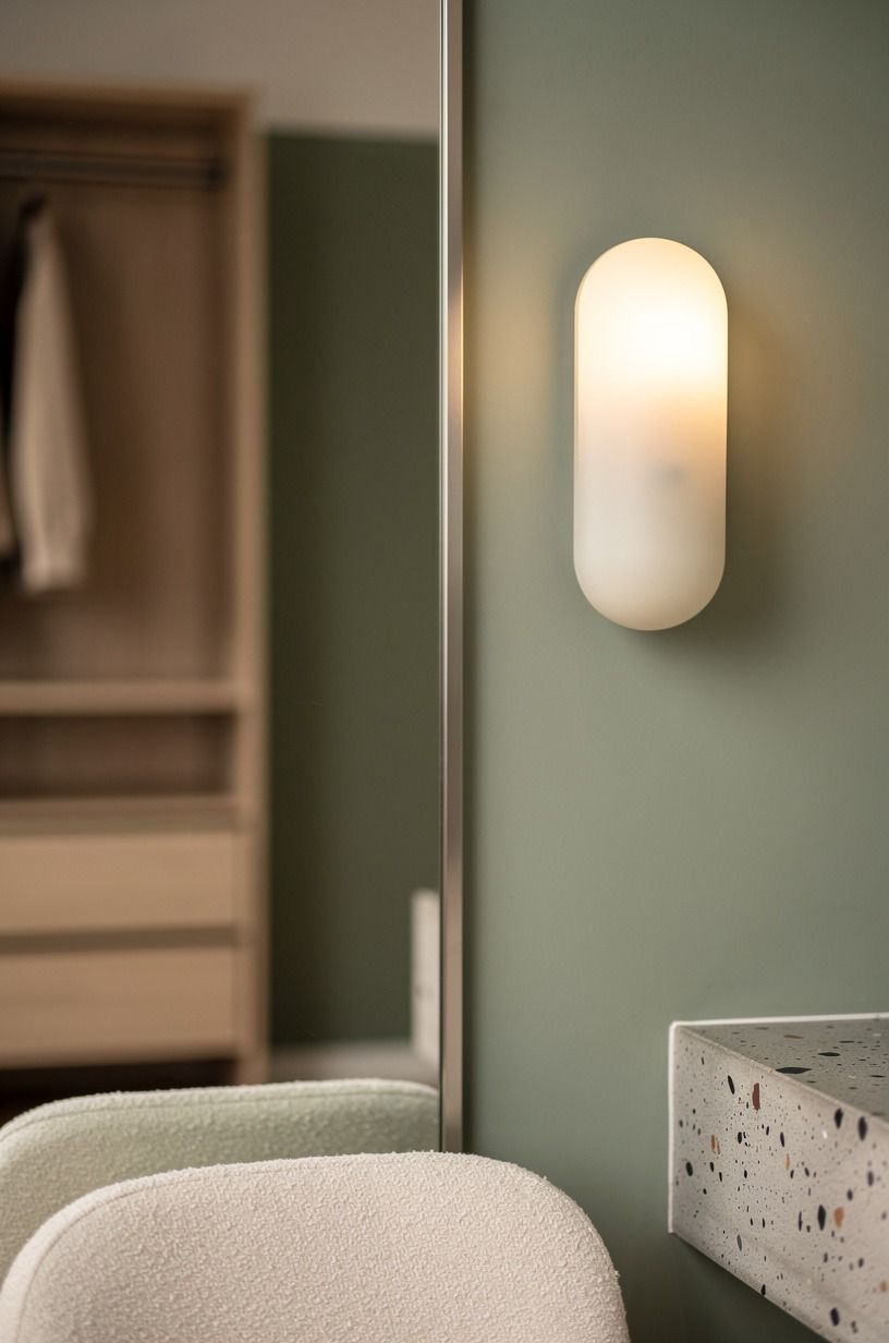 Mount sconces beside the full-length mirror