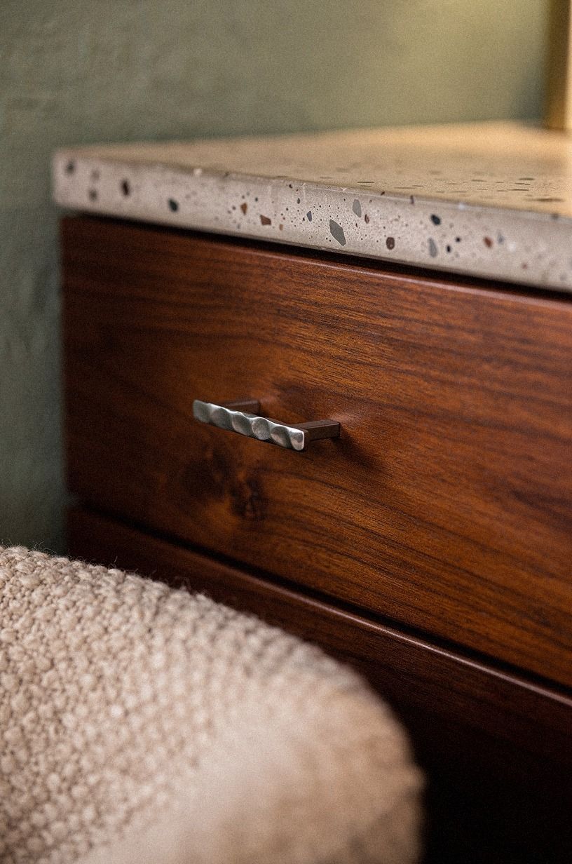 The Tansu Tab: hammer soft metal onto deep teak drawer fronts