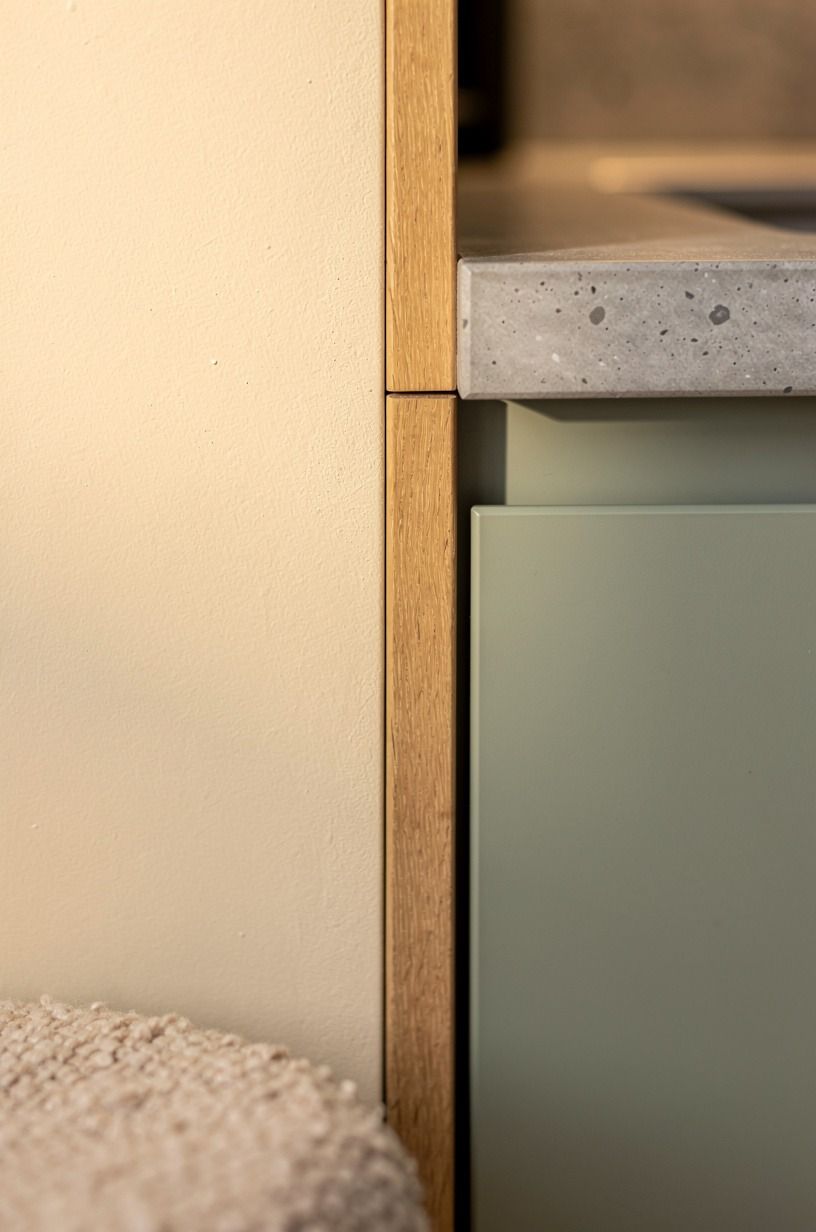 Trim cabinet gaps with oak filler strips