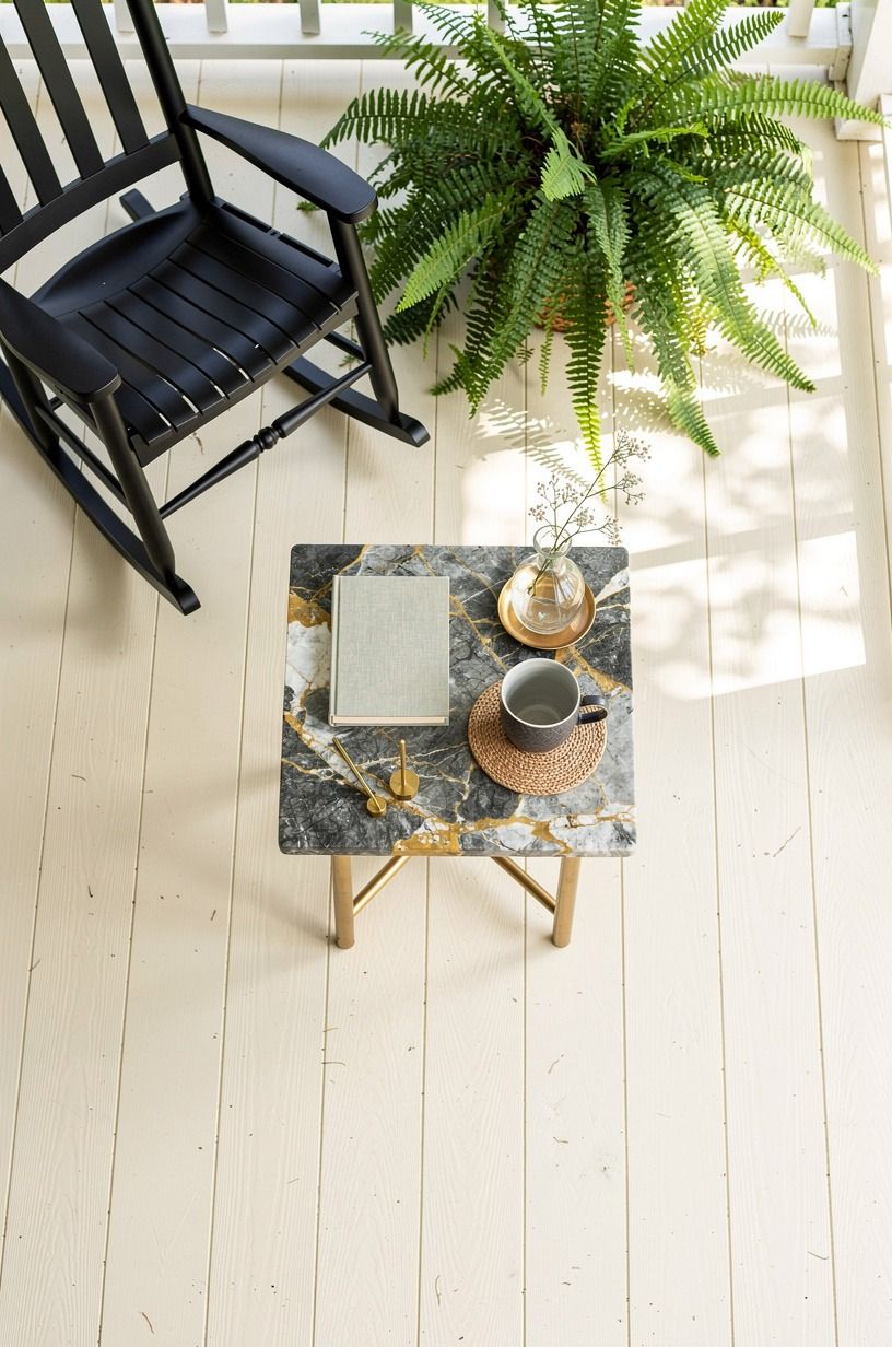 Black rockers against cedar planks, or white wicker through the fern