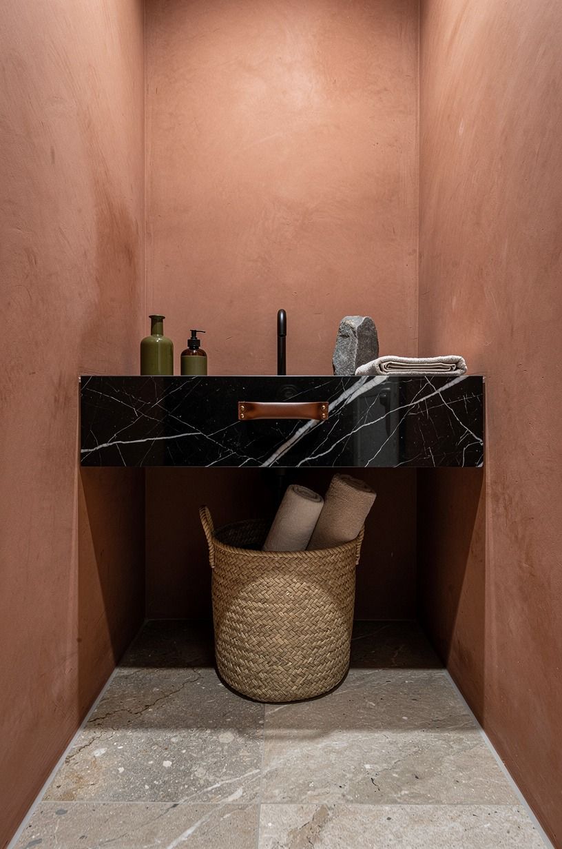 Tucked a basket under the floating sink