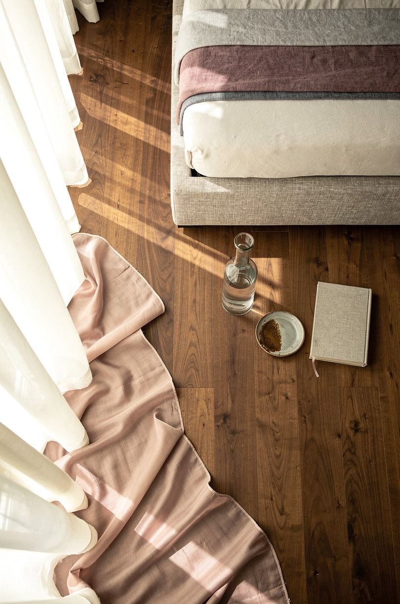 Hang sheer curtains so they puddle on the floor