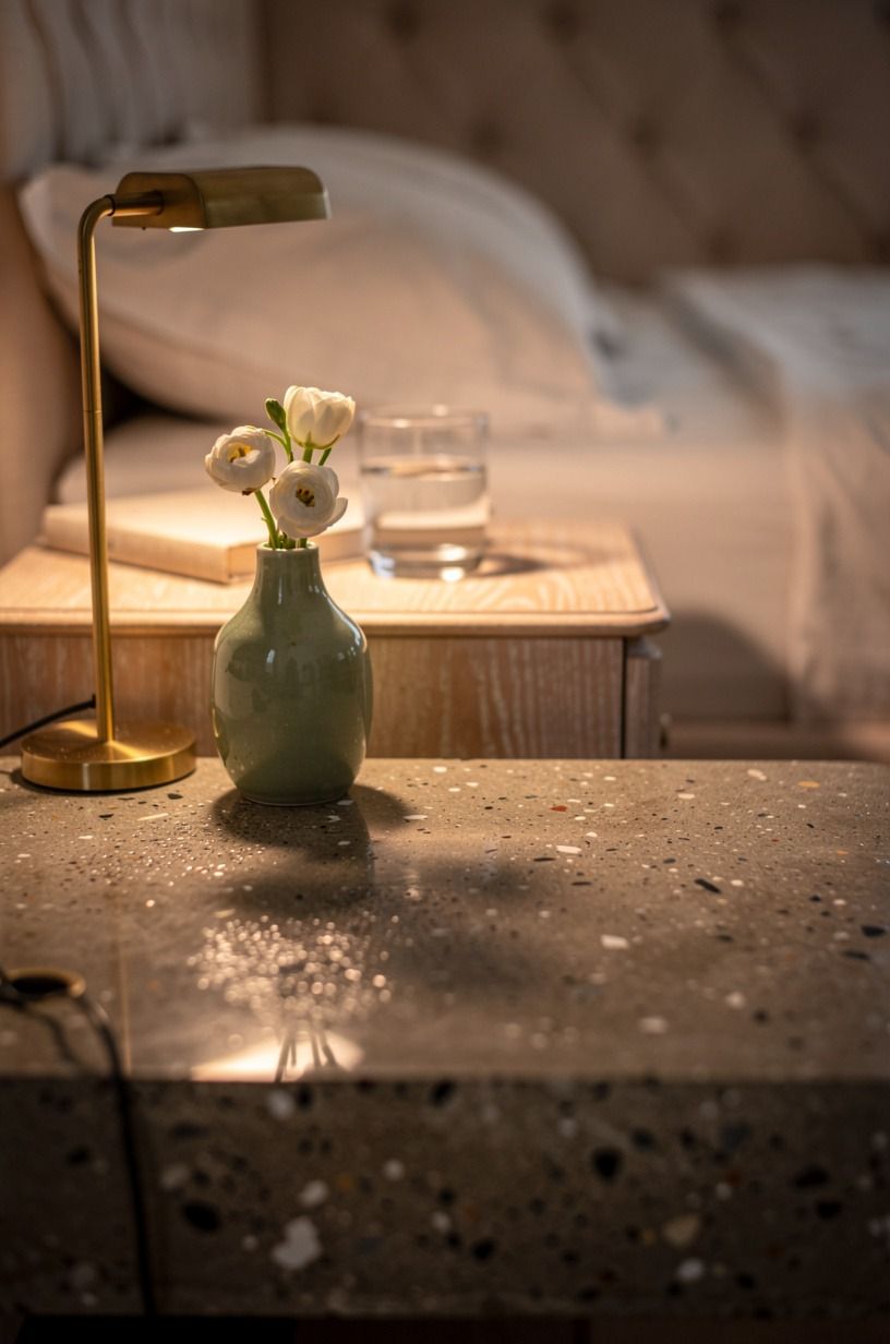 Set a single bud vase beside the reading lamp
