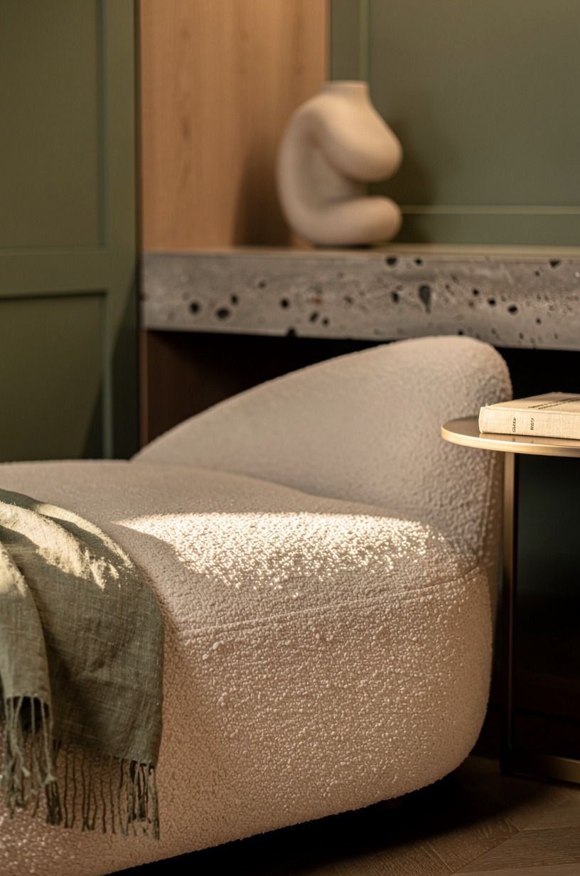 Tuck a velvet chaise into the corner, not an armchair